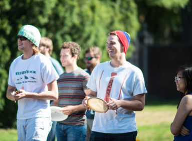 Students playing frisbee golf